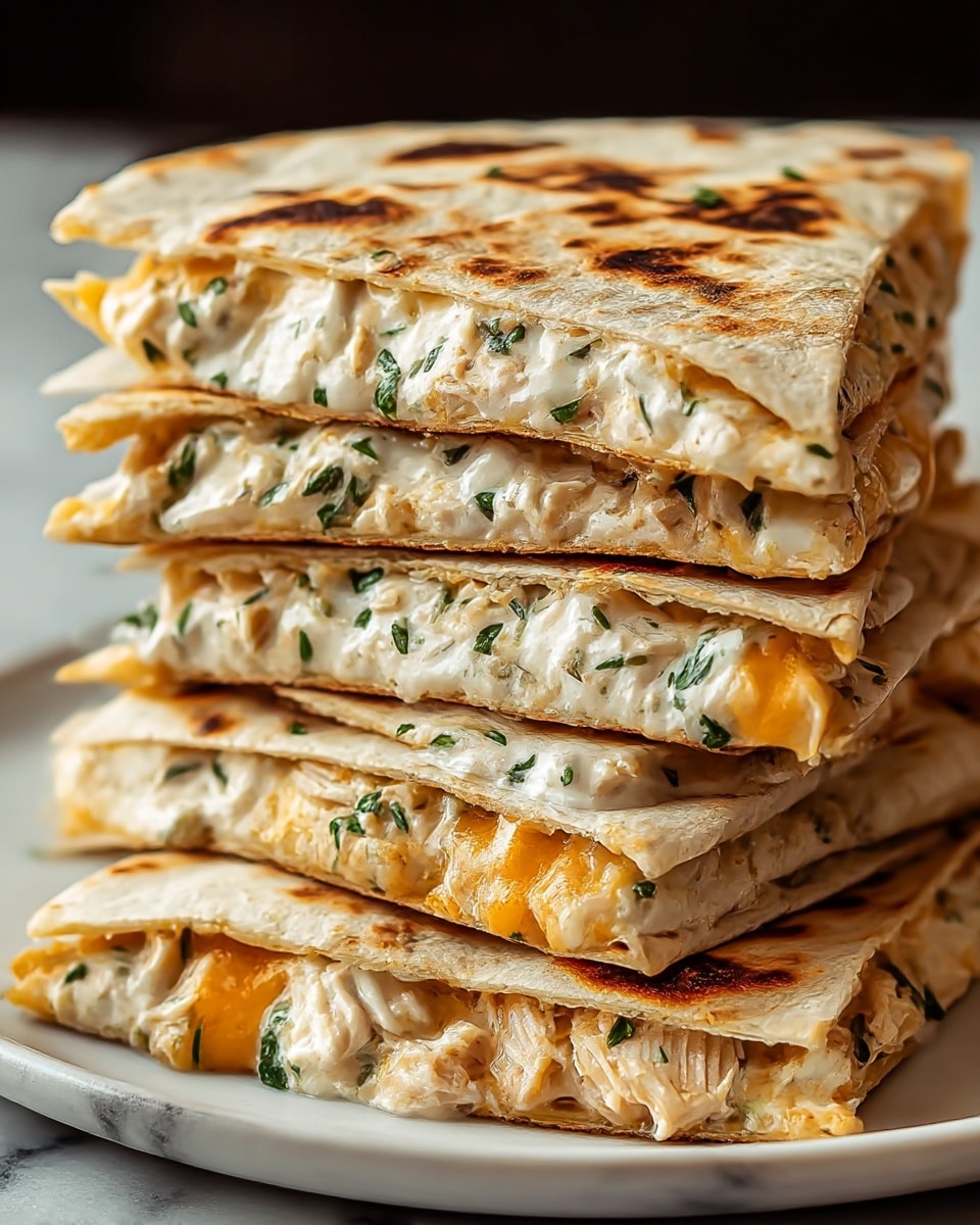 A stack of several triangular quesadilla slices is shown on a white plate, placed on a white marbled surface. Each slice has a toasted, golden-brown tortilla exterior with some charred lines. Inside the quesadilla, there are at least three visible layers filled with melted white cheese mixed with chopped green herbs and small chunks of chicken, along with melted orange cheese. The fillings look creamy and slightly gooey, with bits of herbs spread evenly throughout. The quesadilla slices are piled high, slightly leaning on each other, showing the rich, thick fillings inside. Photo taken with an iphone --ar 4:5 --v 7