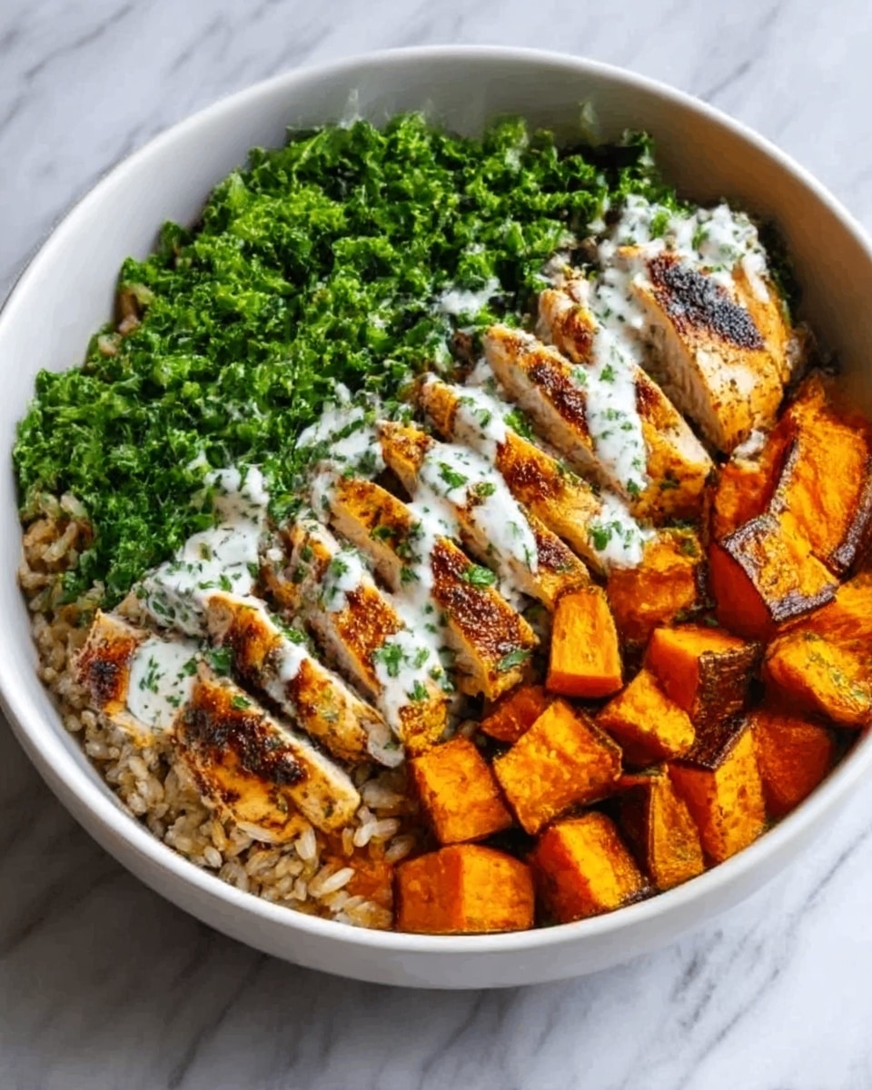 A white bowl sits on a white marbled surface, filled with three main layers arranged side by side. On the left, there are chunks of roasted sweet potato, orange with slight char marks. In the middle, slices of grilled chicken breast are placed neatly, showing a brown and slightly crispy texture with white inside, topped with a drizzle of light green sauce sprinkled with small herbs. On the right, there is a vibrant green pile of chopped kale leaves, finely cut and fresh. The bowl is viewed from above, showing all ingredients clearly. Photo taken with an iphone --ar 4:5 --v 7